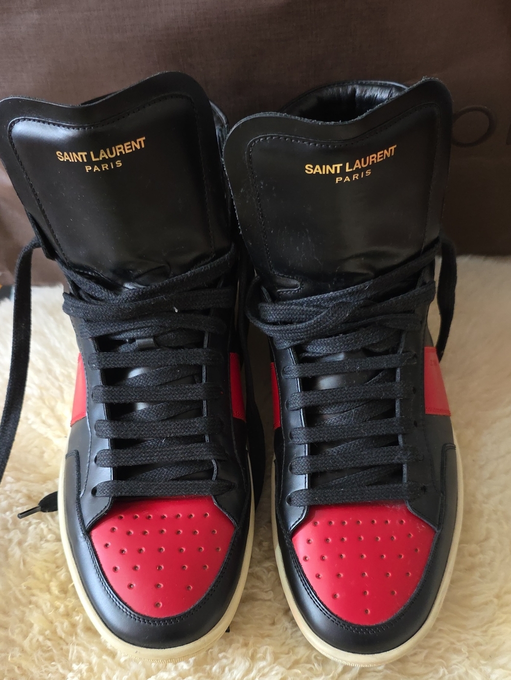 Saint Laurent High-Top Leather Sneakers in Black & Red
